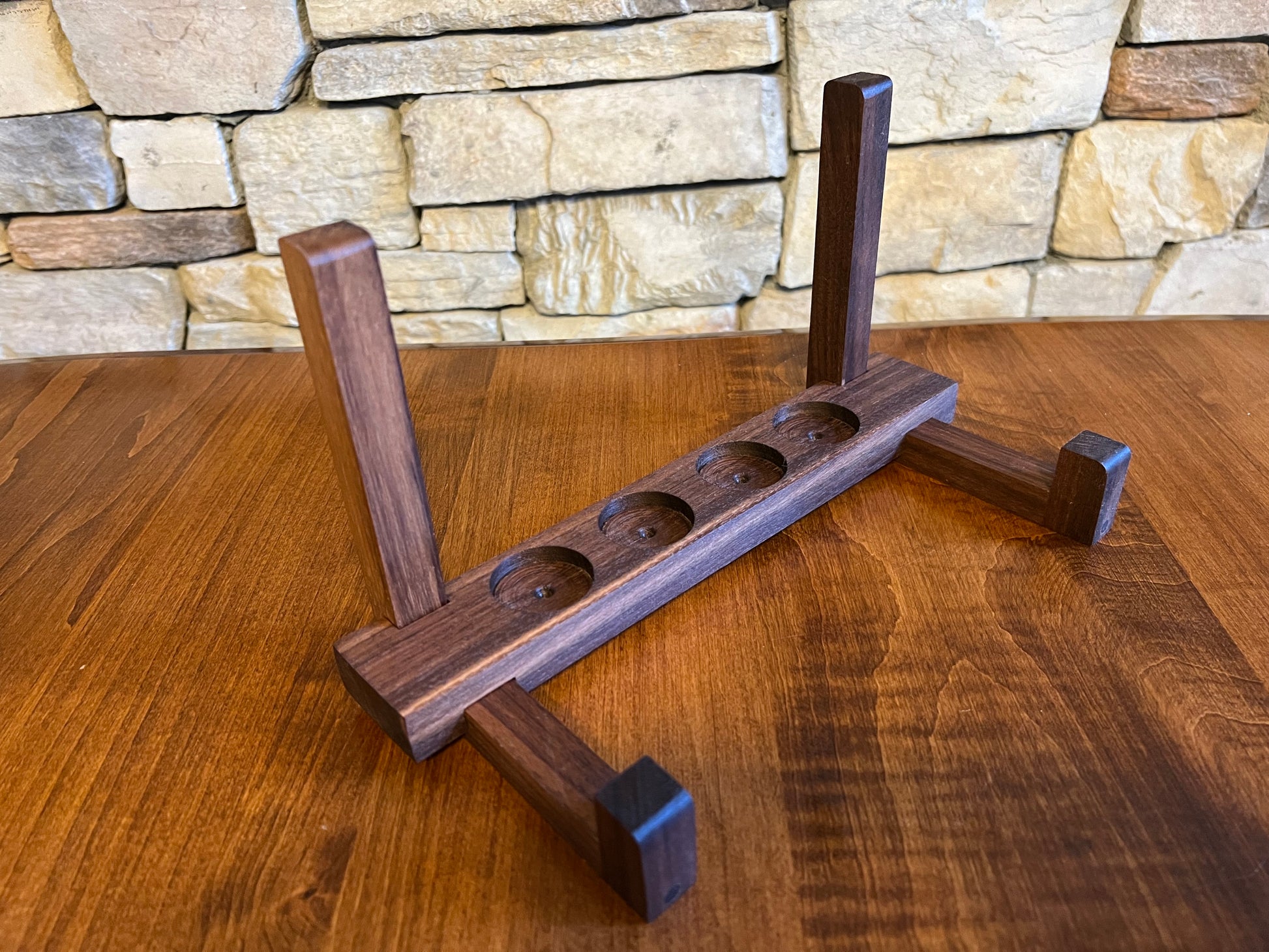 Tequila shot flight tray holder is made of hardwood walnut.  Designed to hold four tequila shot glasses on the backside of the board.  A perfect way to display your personalized tequila shot flight board.  A must have for tequila barware.