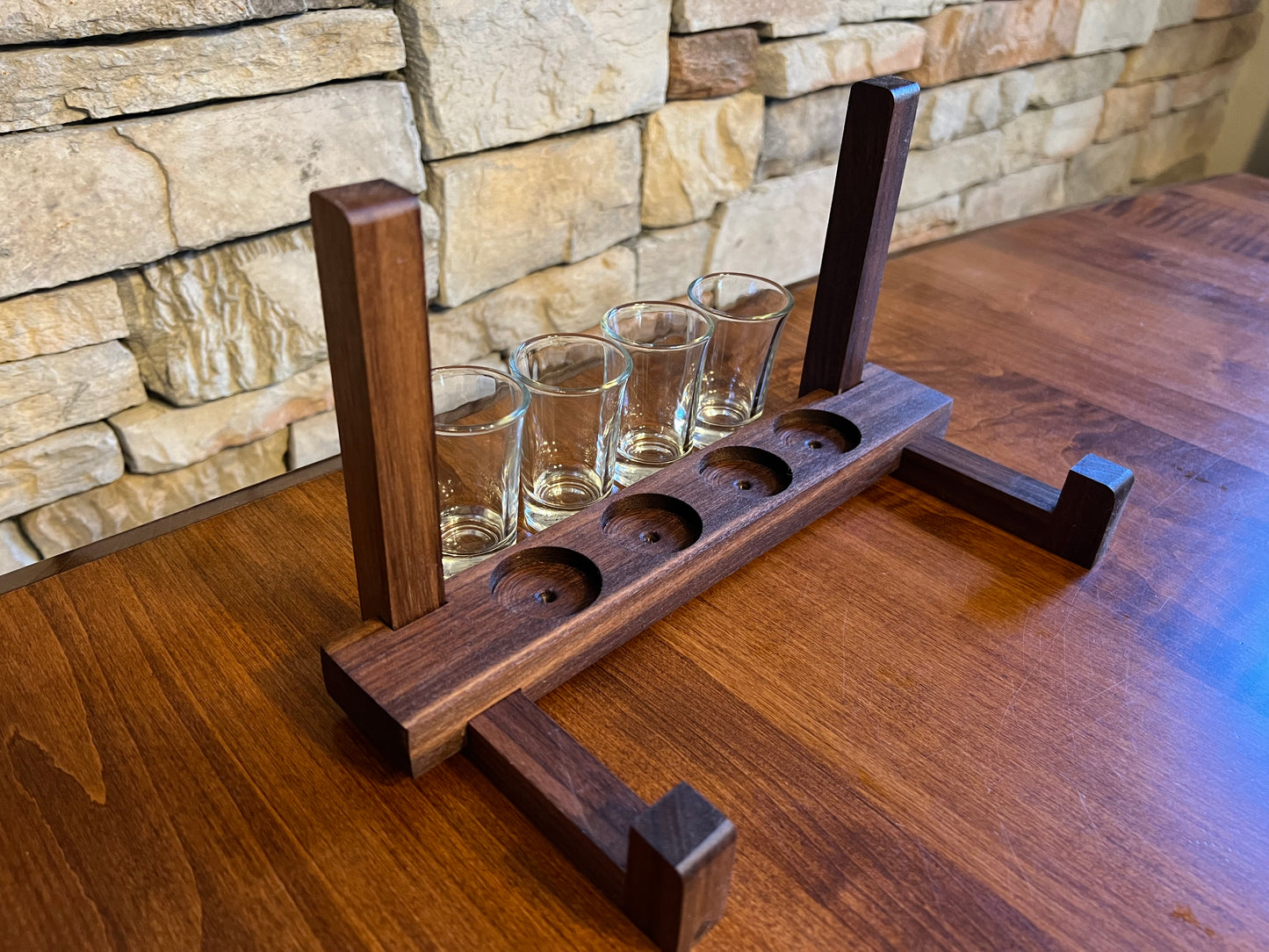 Personalized tequila shot board with shot stand for glasses.