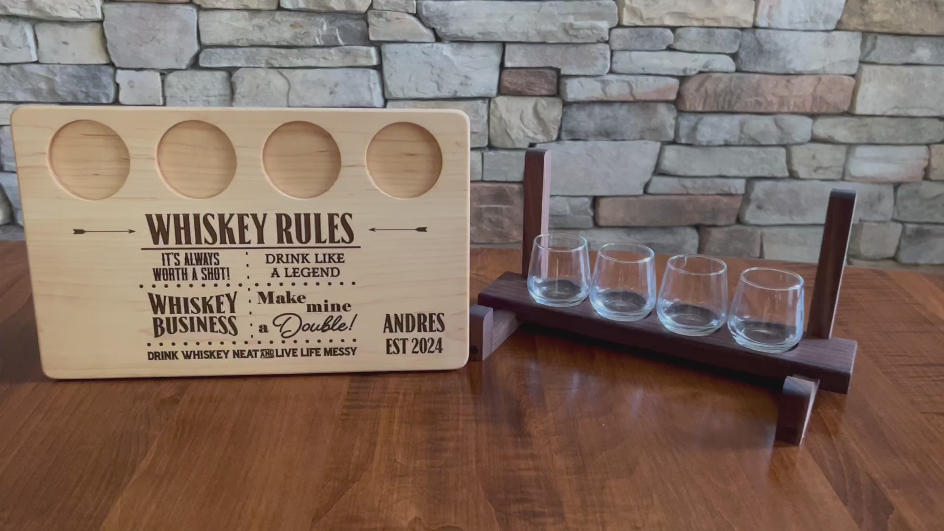 Personalized maple whiskey board shown with whiskey shot glasses and a shot glass holder. Whiskey rules theme drink like a legend. Perfect gift for whiskey drinker. ￼