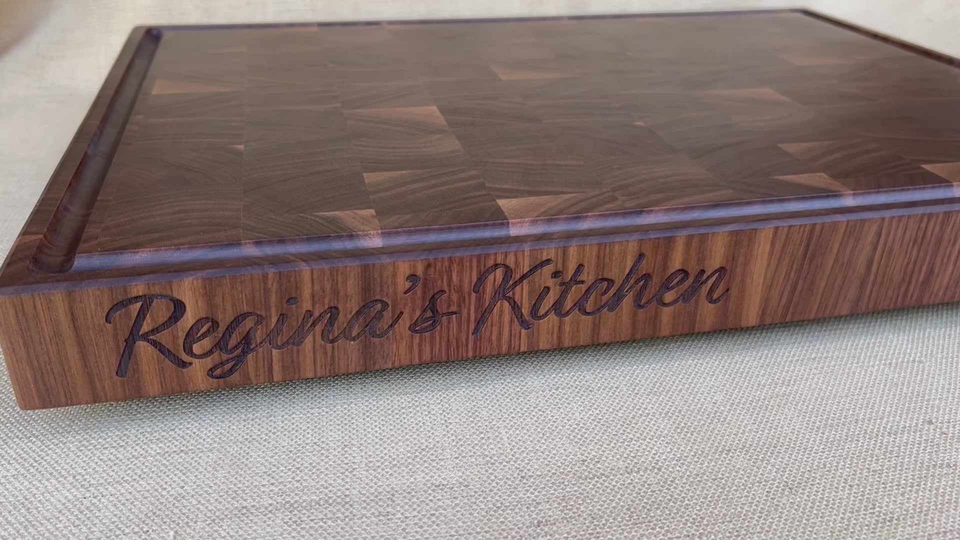 Personalized butcher block board with name engraved on the edge of the board.  Personalized chefs gift for the kitchen.  Personalized wedding gift custom butcher block made from walnut end grain. Perfect gift for the BBQ smoker.